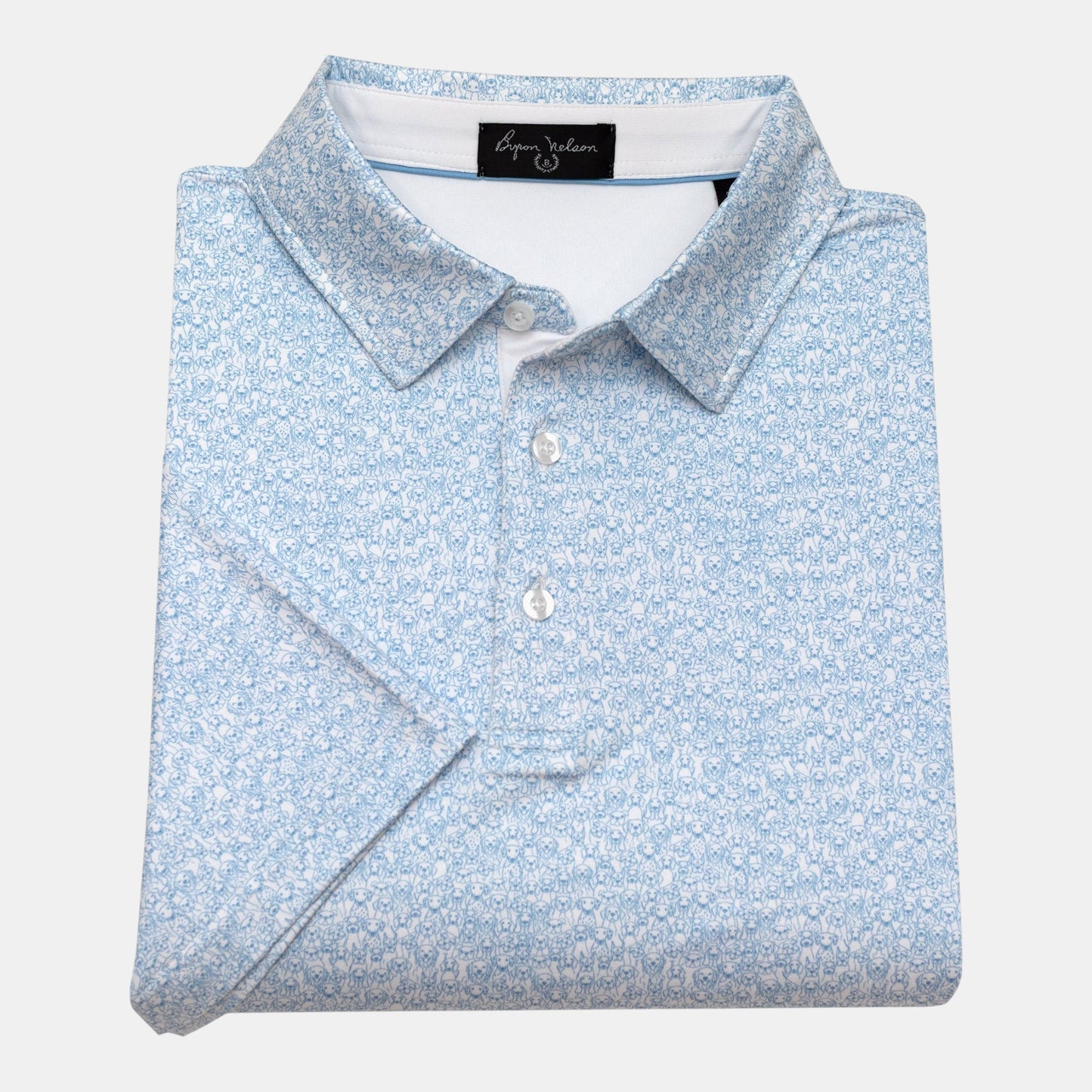 Byron Nelson light blue polo shirt with an all-over white dog print, short sleeves, and button collar.