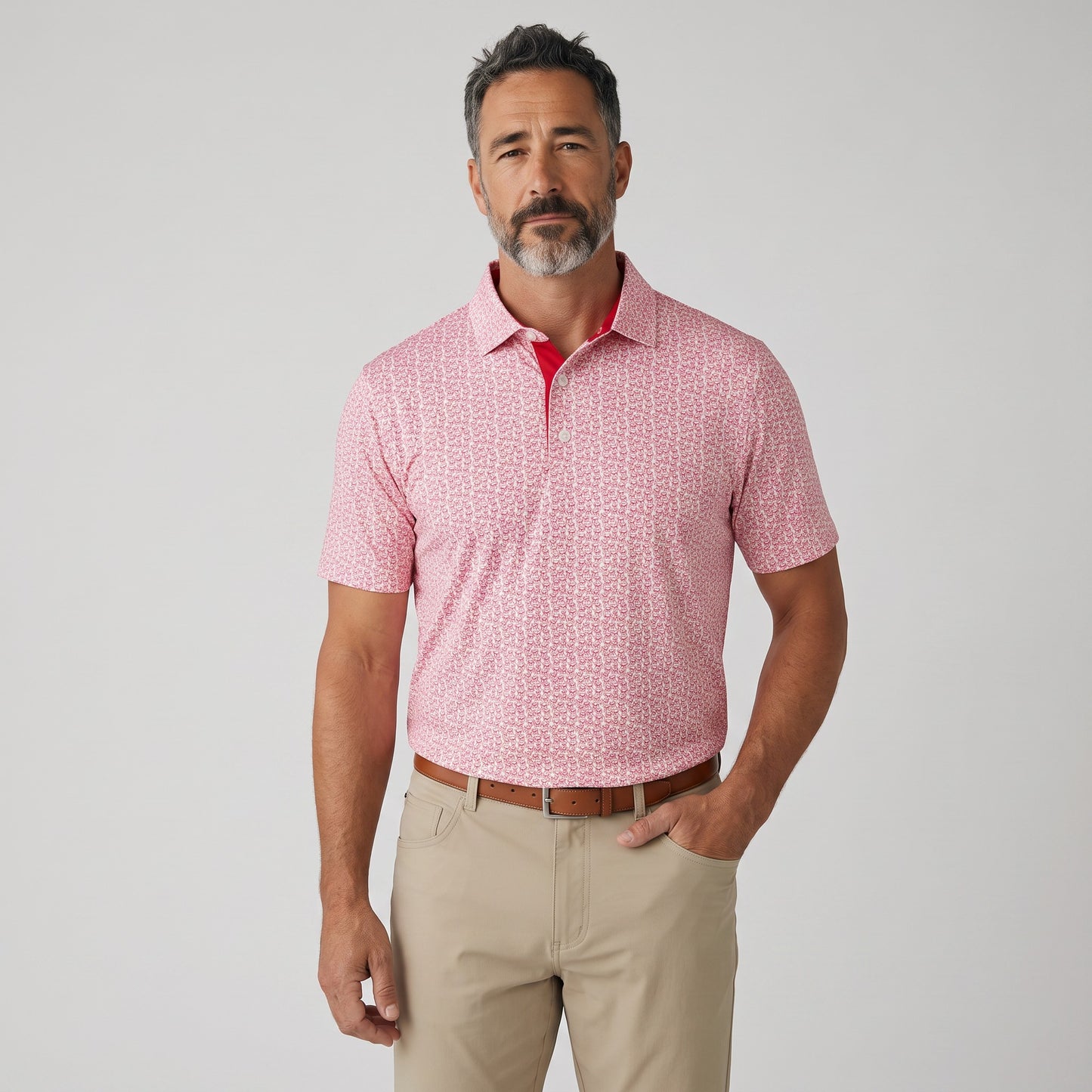 Byron Nelson men's pink bulldog print polo shirt with moisture-wicking stretch fabric and a tailored fit.