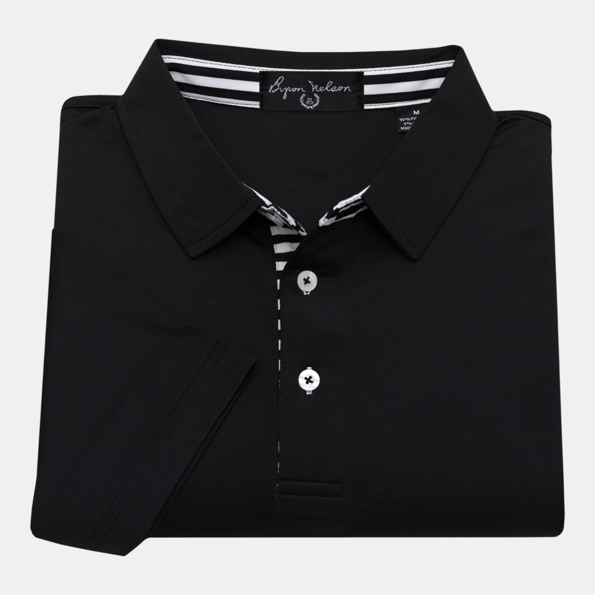 Byron Nelson black performance polo shirt with striped placket and neck band. 95% Polyester, 5% Spandex.