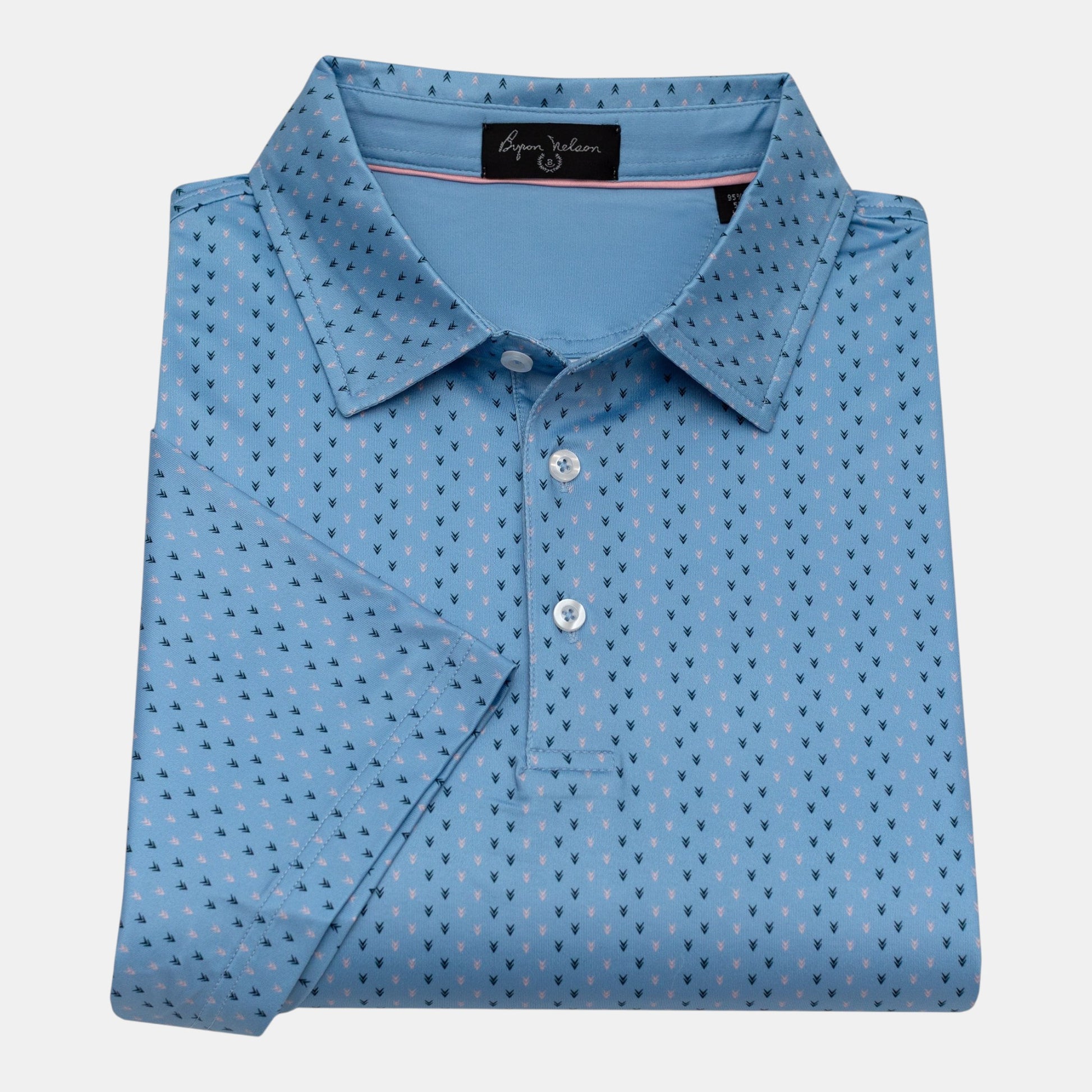 Byron Nelson light blue short-sleeve polo shirt with a subtle all-over arrow pattern in navy and pink. Made from polyester/spandex blend.