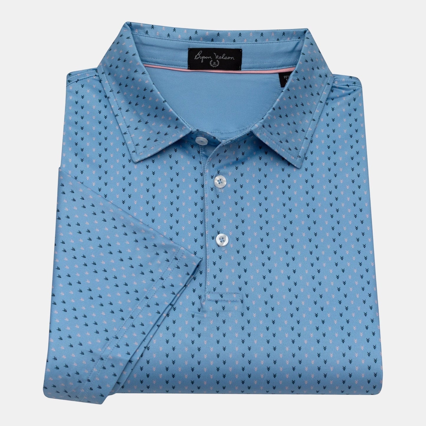 Byron Nelson light blue short-sleeve polo shirt with a subtle all-over arrow pattern in navy and pink. Made from polyester/spandex blend.