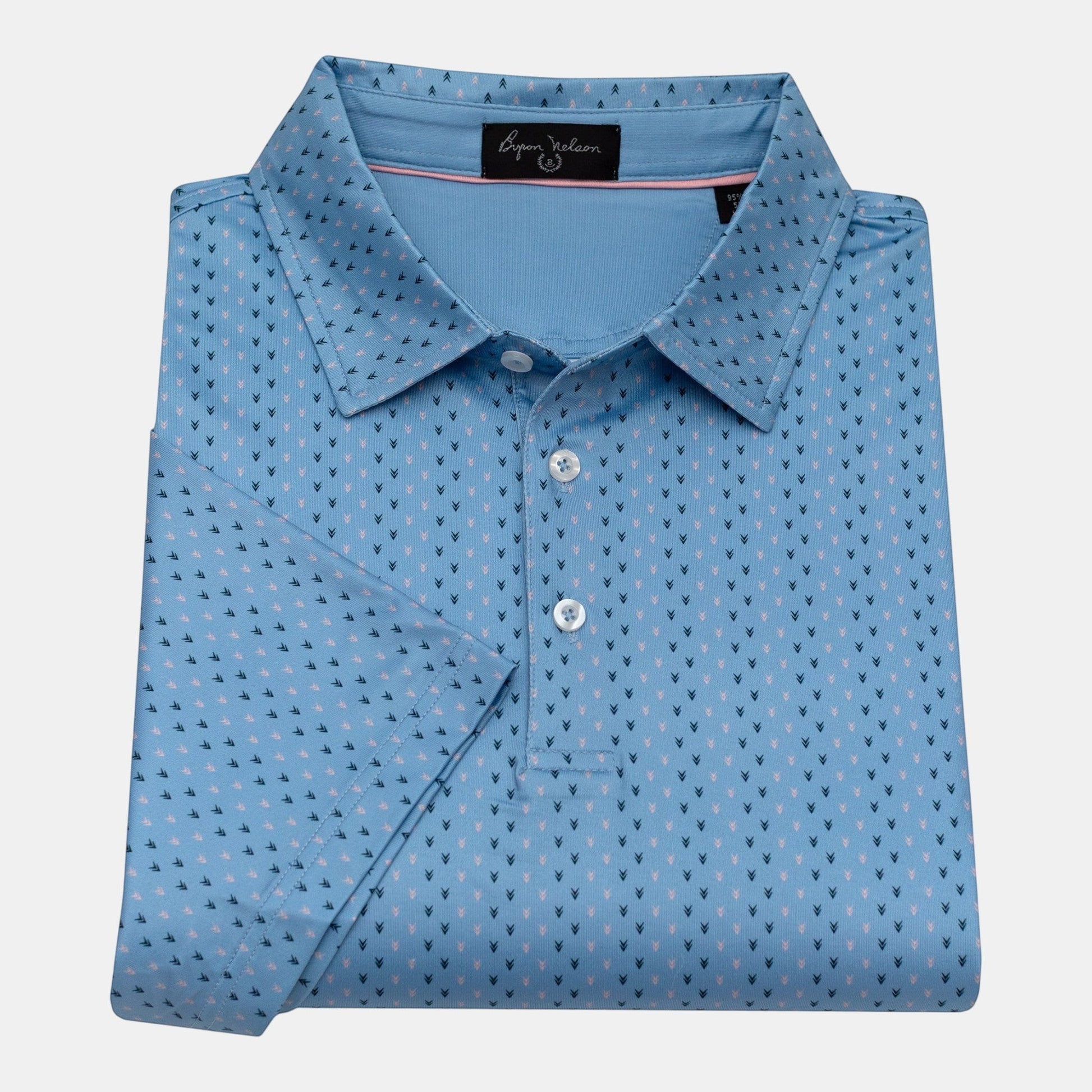 Byron Nelson light blue short-sleeve polo shirt with a subtle all-over arrow pattern in navy and pink. Made from polyester/spandex blend.