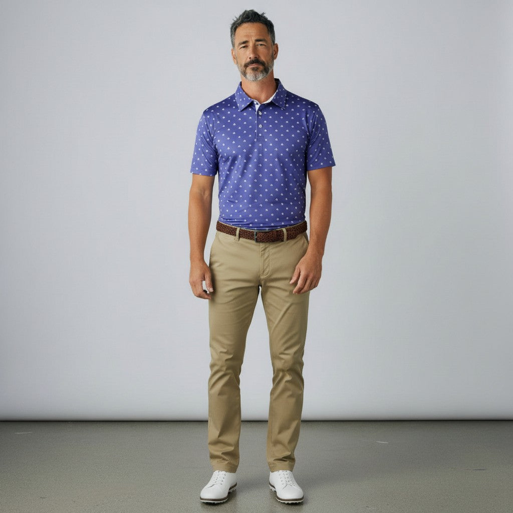 Byron Nelson Carolina Bloom blue patterned performance golf polo shirt worn by a man with khaki trousers.