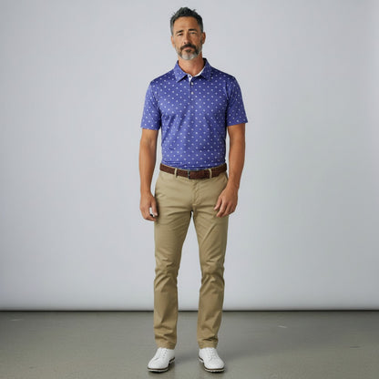 Byron Nelson Carolina Bloom blue patterned performance golf polo shirt worn by a man with khaki trousers.