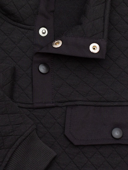 Byron Nelson Carolina Quilted Pullover in black, featuring diamond quilting, snap placket, and chest pocket. Cotton-polyester blend.