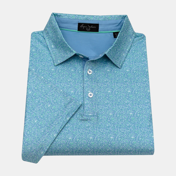 Byron Nelson Coastal Classic polo shirt in blue with a white and green abstract floral print. Made of polyester/spandex.