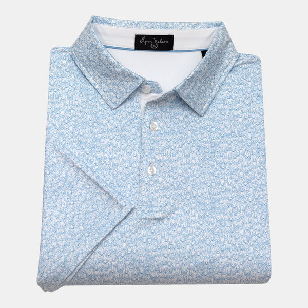 Byron Nelson light blue polo shirt with an all-over white dog print, short sleeves, and button collar.