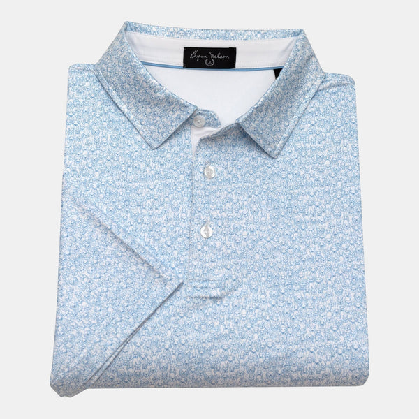 Byron Nelson light blue polo shirt with an all-over white dog print, short sleeves, and button collar.