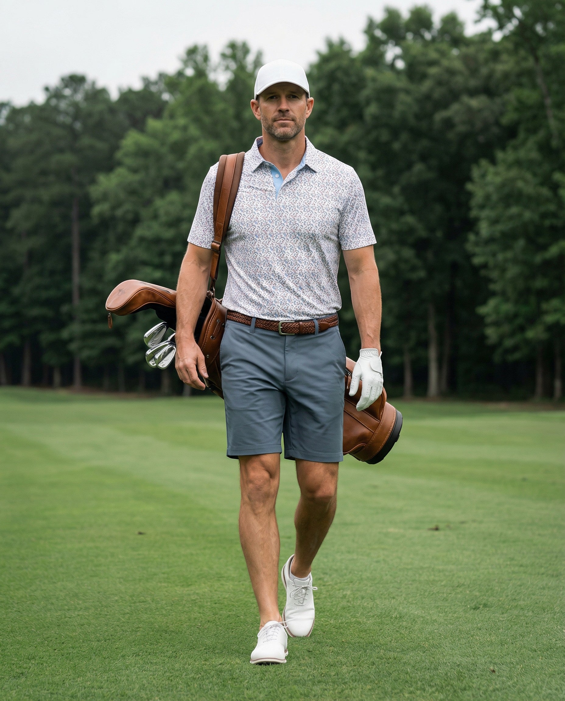 Byron Nelson Fairway Flock polo shirt with parrot print, light blue collar, made of polyester and spandex blend.