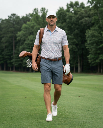 Byron Nelson Fairway Flock polo shirt with parrot print, light blue collar, made of polyester and spandex blend.