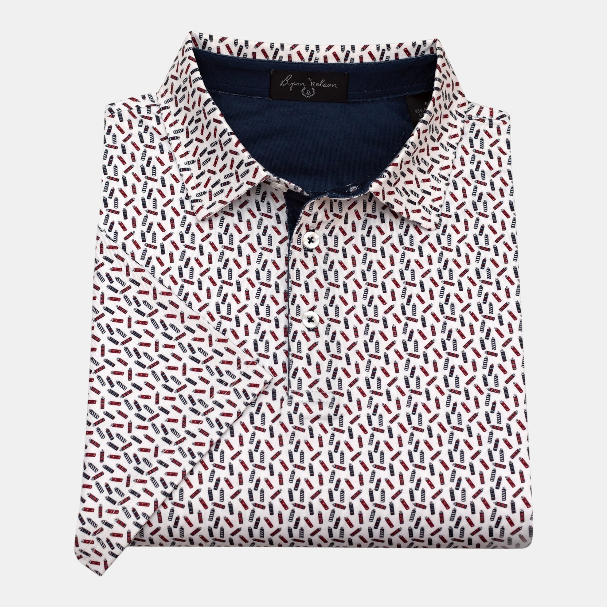 Byron Nelson The Firecracker Polo shirt with red, white, and blue fireworks pattern on navy fabric. 95% polyester, 5% spandex.