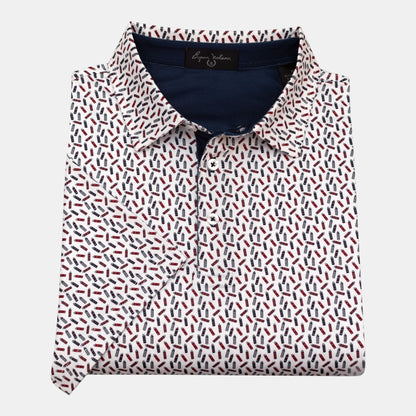 Byron Nelson The Firecracker Polo shirt with red, white, and blue fireworks pattern on navy fabric. 95% polyester, 5% spandex.