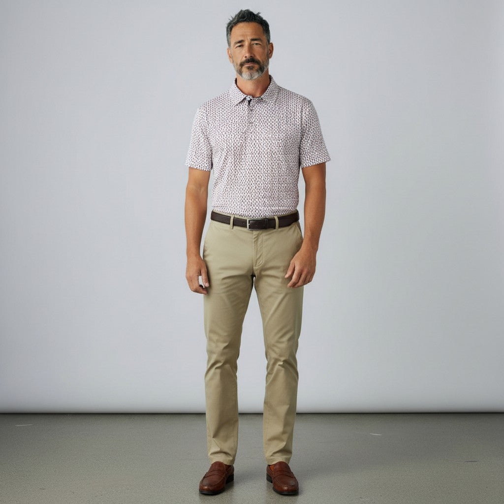 Byron Nelson The Firecracker Polo shirt with a red, white, and blue firework pattern on a navy background. Made of polyester and spandex.