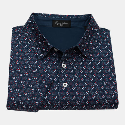 Byron Nelson navy blue polo shirt with all-over red, white, and blue firework pattern. Made from polyester and spandex blend.