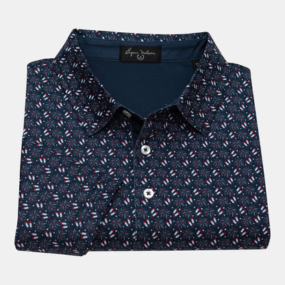Byron Nelson navy blue polo shirt with all-over red, white, and blue firework pattern. Made from polyester and spandex blend.