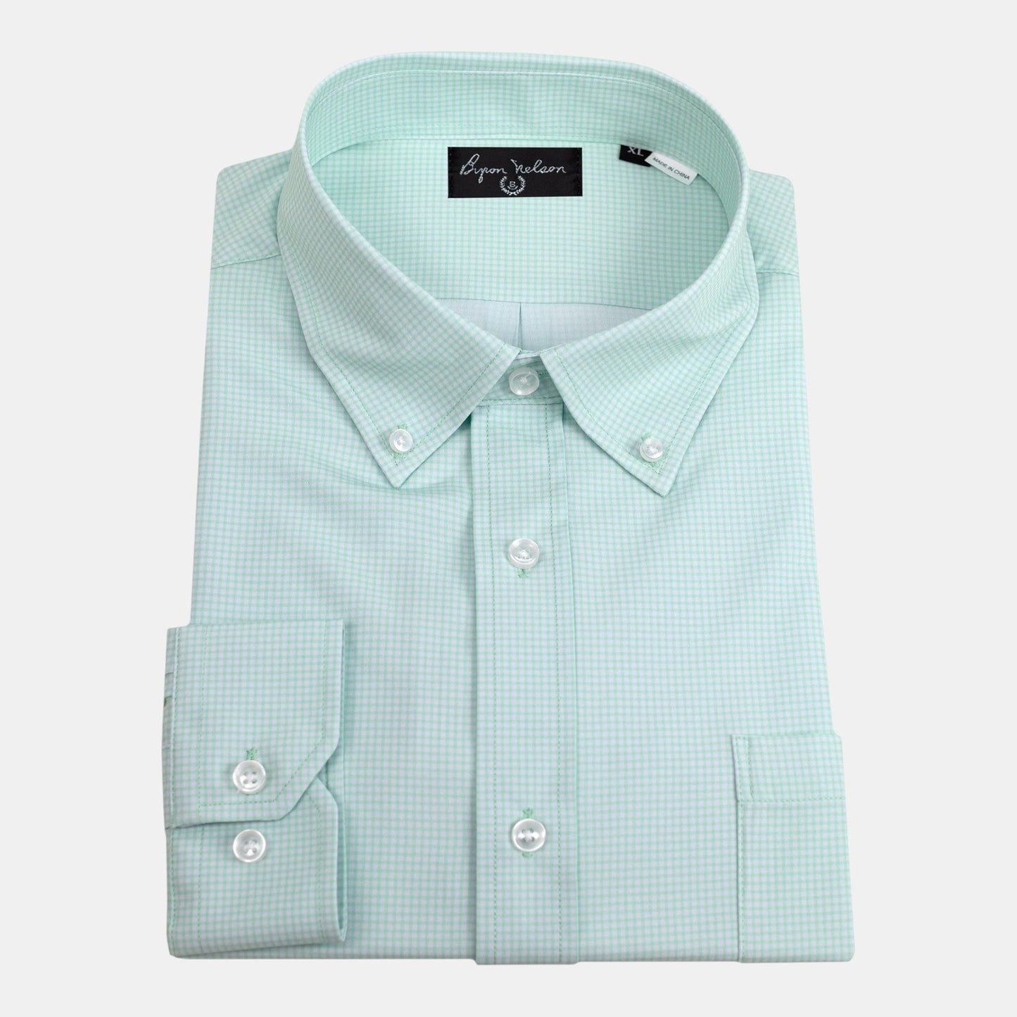 Byron Nelson light green performance button down shirt with a subtle checkered pattern and button-down collar.
