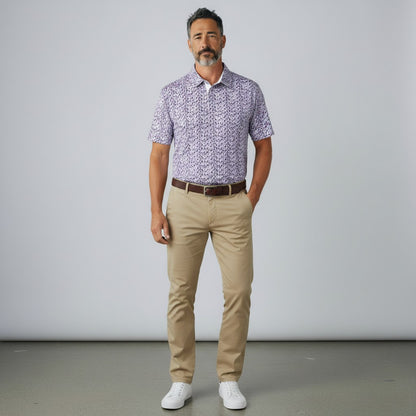 Byron Nelson Happy Hour Polo in purple drink glass print with moisture-wicking stretch fabric on a male model.