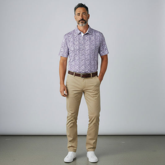 Byron Nelson Happy Hour Polo in purple drink glass print with moisture-wicking stretch fabric on a male model.