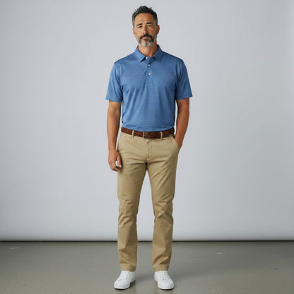 Byron Nelson Key West Polo in Baltic Blue with white stripes, worn by a man with khaki pants and white sneakers.