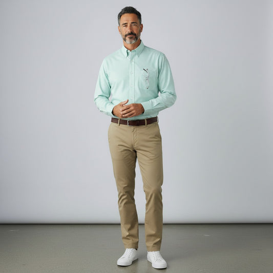 Byron Nelson performance button down shirt in light green with a tailored fit, worn with khaki trousers.