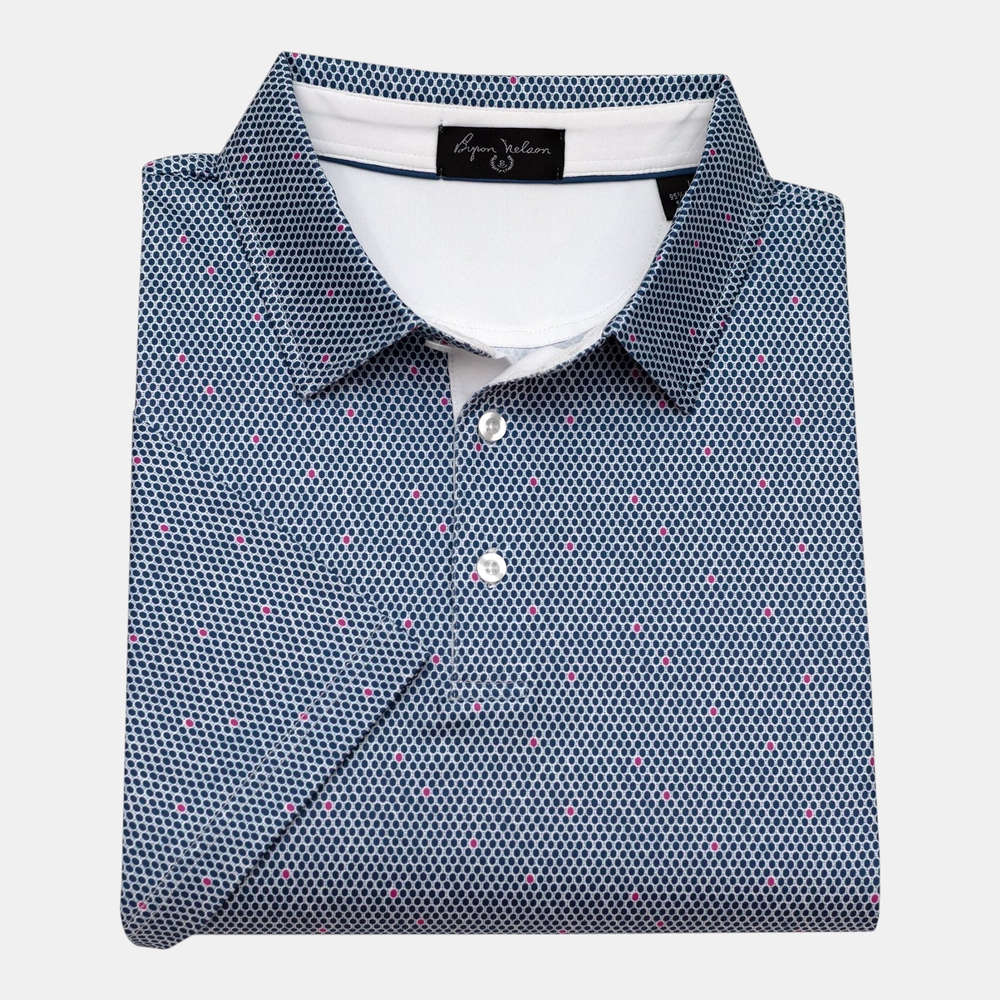 Byron Nelson Midnight Mesh golf polo shirt in navy with a small pink dot pattern. Made of polyester and spandex.