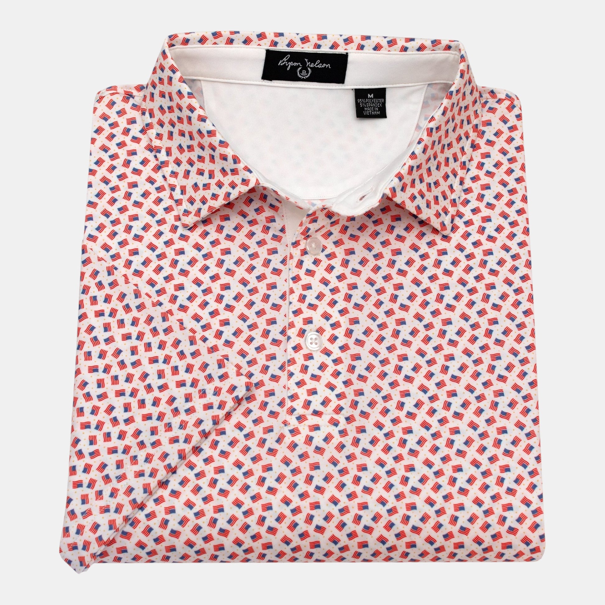 Byron Nelson white polo shirt with all-over print of small American flags and gold stars. Made of polyester and spandex.