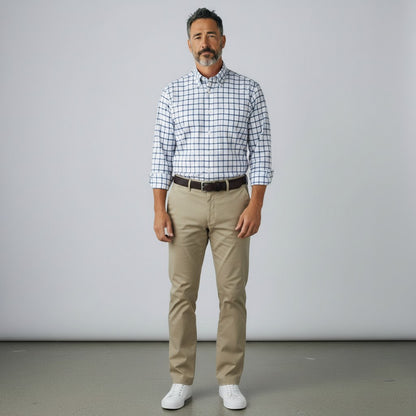 Byron Nelson performance button down shirt with a blue grid pattern, worn by a man with khaki trousers.