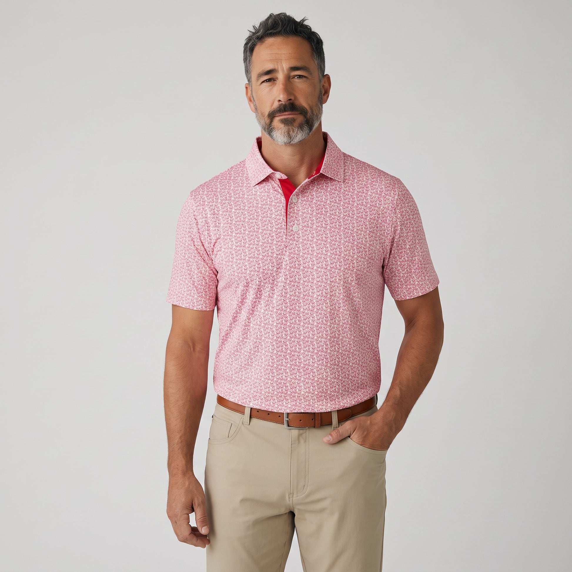 Byron Nelson men's pink bulldog print polo shirt with moisture-wicking stretch fabric and a tailored fit.