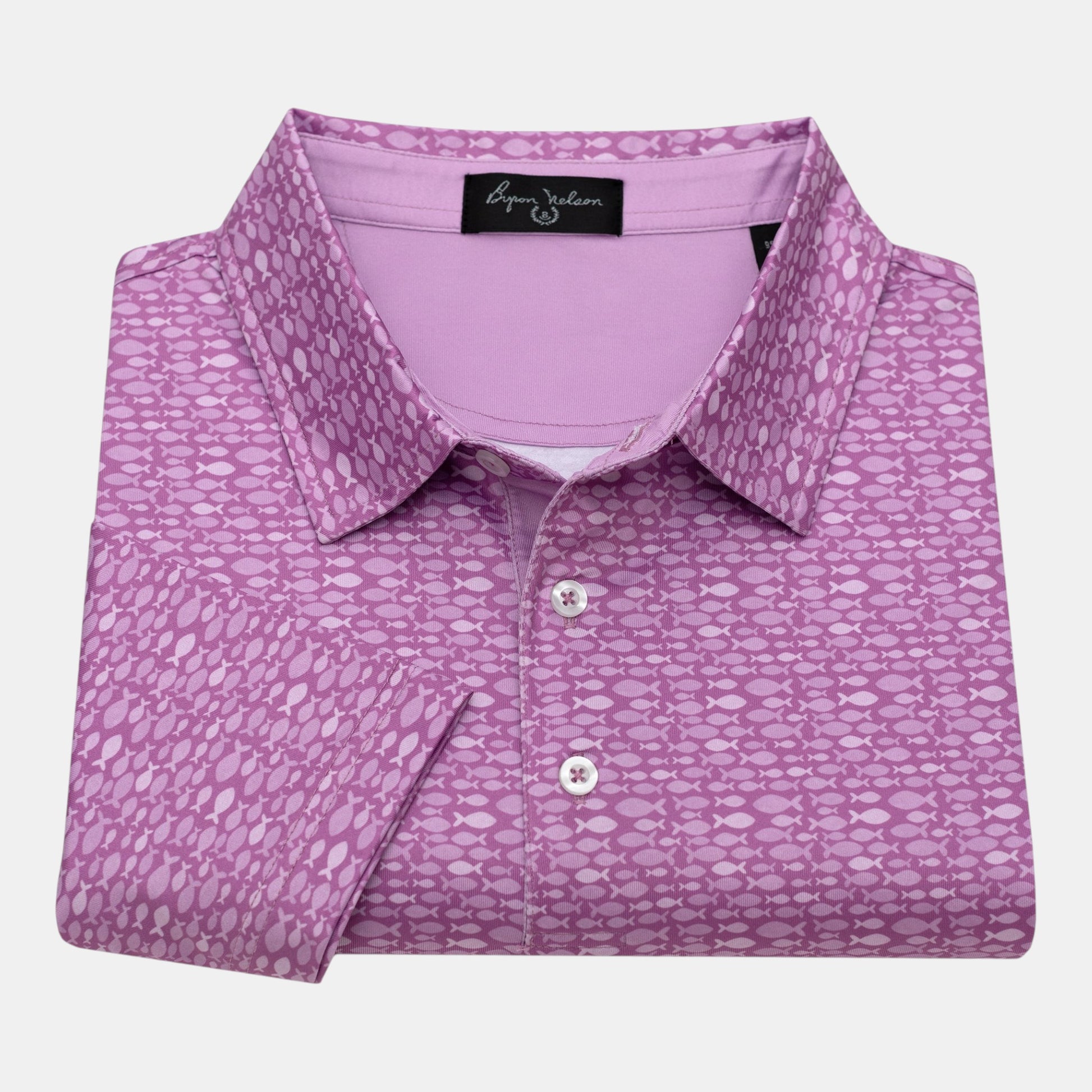 Byron Nelson Pink Pacific Polo with a geometric fish pattern, made from a polyester-spandex blend.
