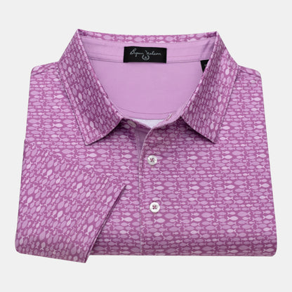 Byron Nelson Pink Pacific Polo with a geometric fish pattern, made from a polyester-spandex blend.