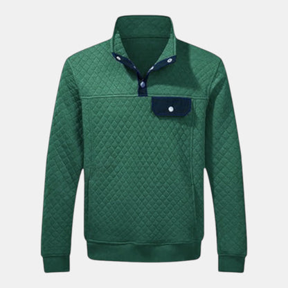 Byron Nelson green quilted pullover with navy snap placket and chest pocket. Cotton-polyester blend.