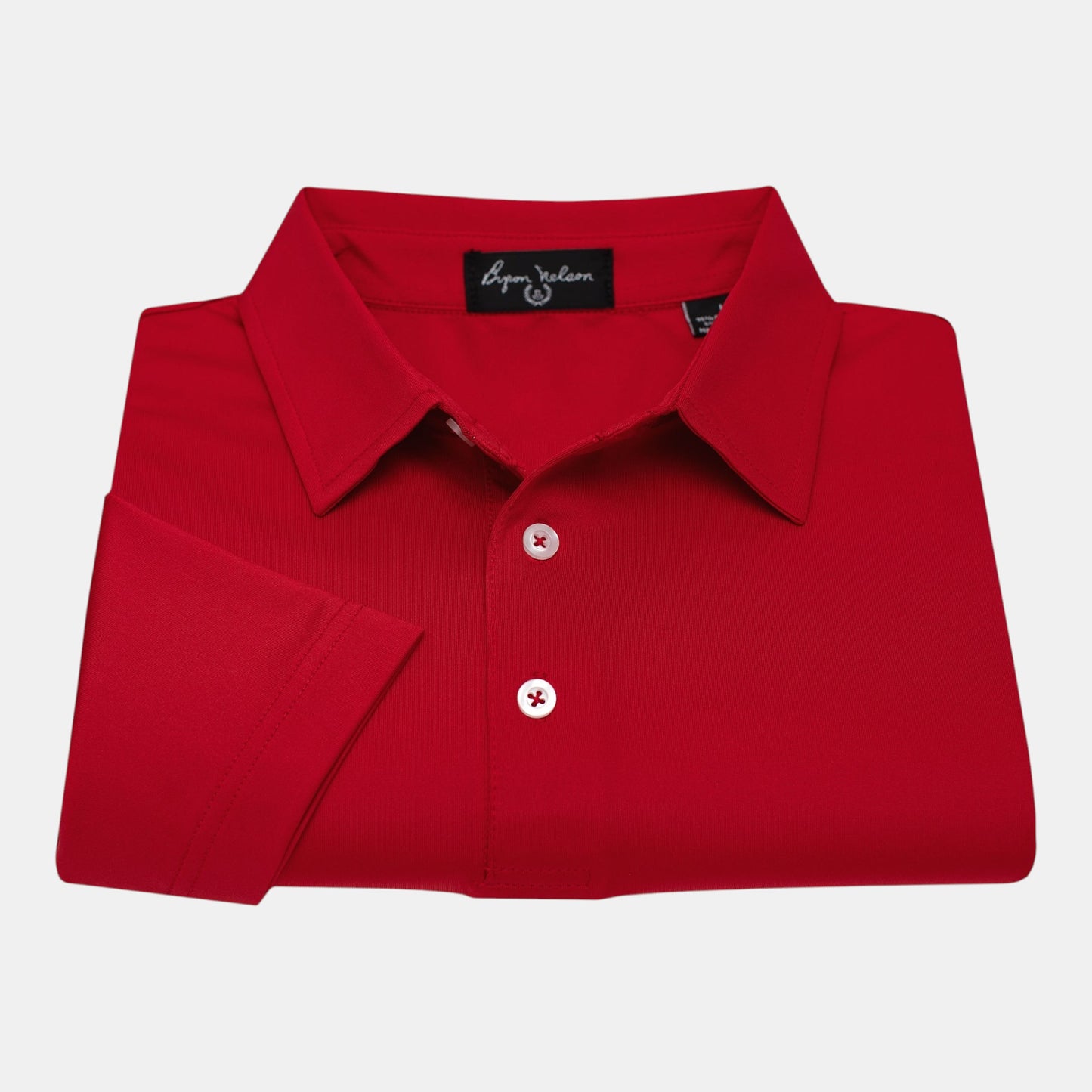 Byron Nelson red short-sleeve polo shirt made from polyester and spandex jersey with white buttons and an open sleeve design.