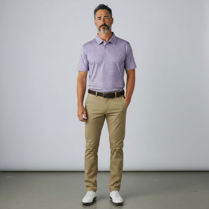 Byron Nelson Reef Rider Polo in light purple with seahorse print, worn by a man with khaki trousers and golf shoes.