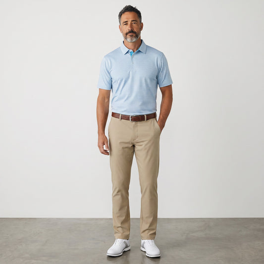 Byron Nelson sea glass blue moisture-wicking polo shirt with a subtle stripe pattern worn by a man with chinos.