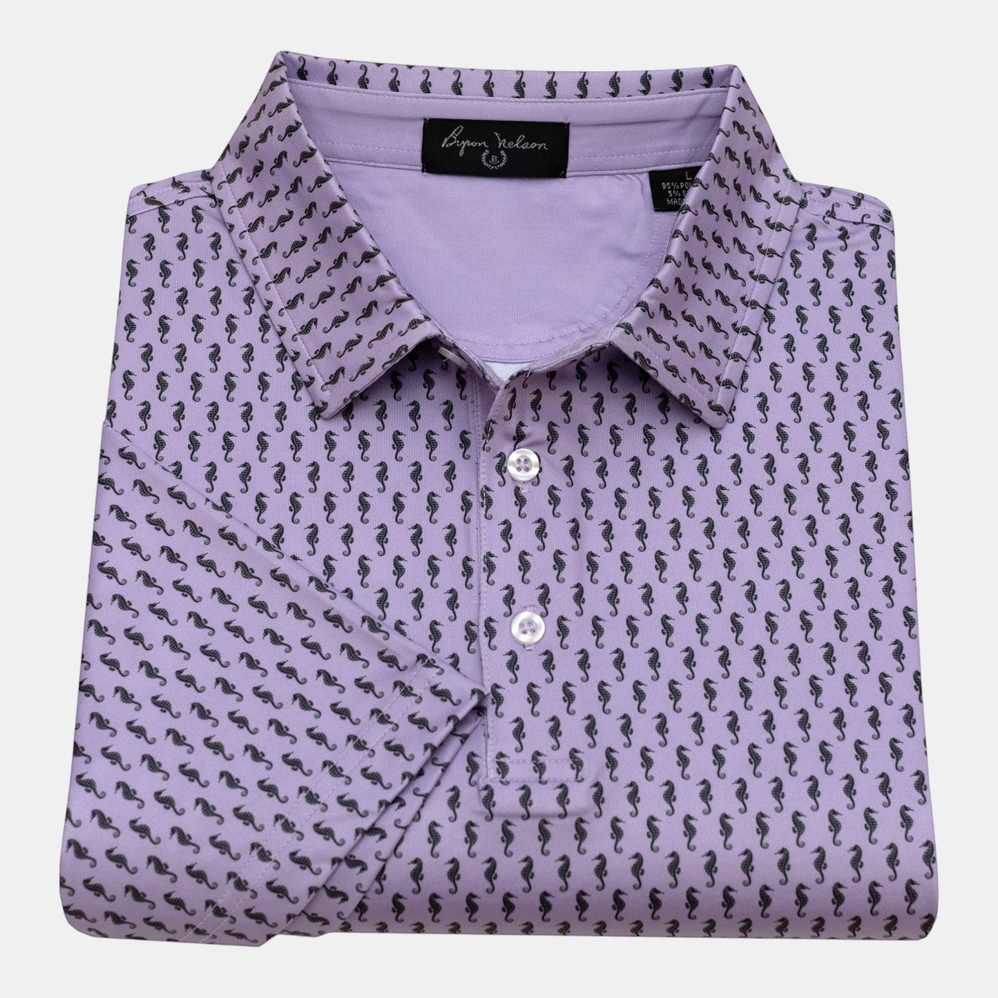 Byron Nelson lavender polo shirt with all-over black seahorse print, performance fabric, and button collar.