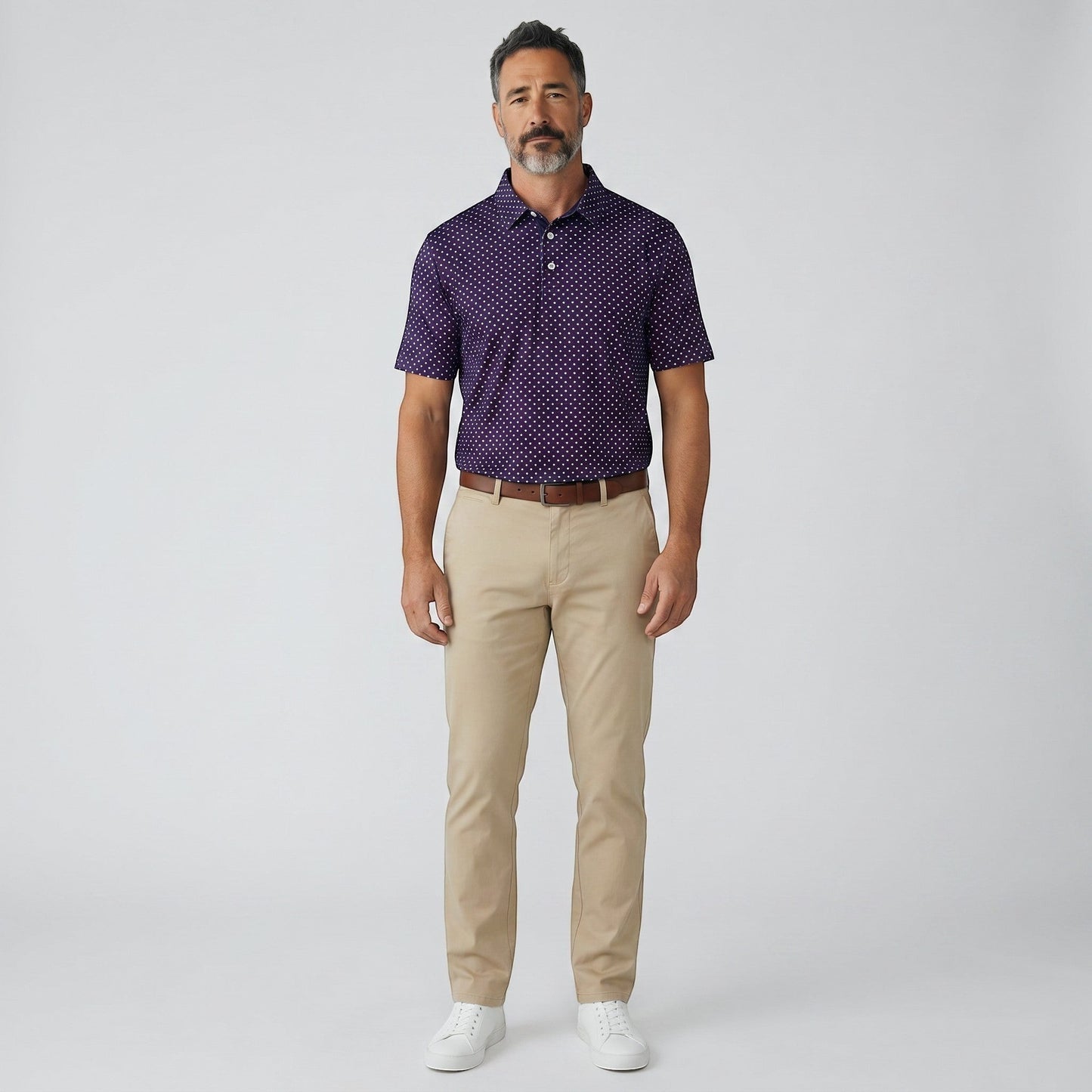 Byron Nelson Star Polo: Men's purple polyester-spandex polo with white polka dots, tailored fit, and moisture-wicking fabric.