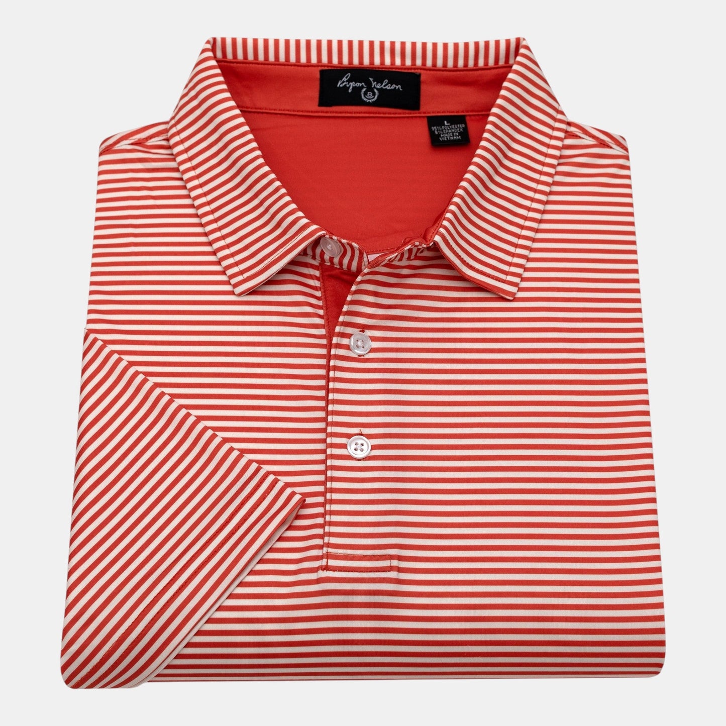 Byron Nelson red and white striped short-sleeve polo shirt made of polyester and spandex blend.