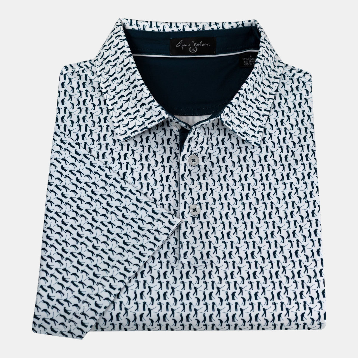 Byron Nelson Sunday Swing Polo in white with a navy blue golfer pattern, featuring a classic collar and button placket