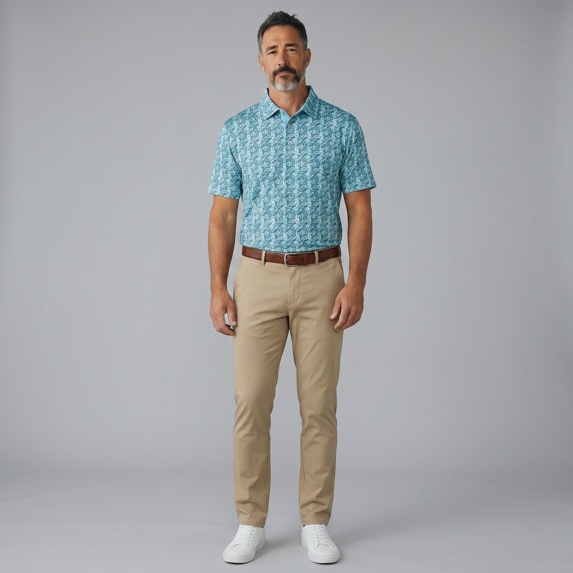 Byron Nelson men's teal paisley print short-sleeve golf polo made from polyester-spandex blend.