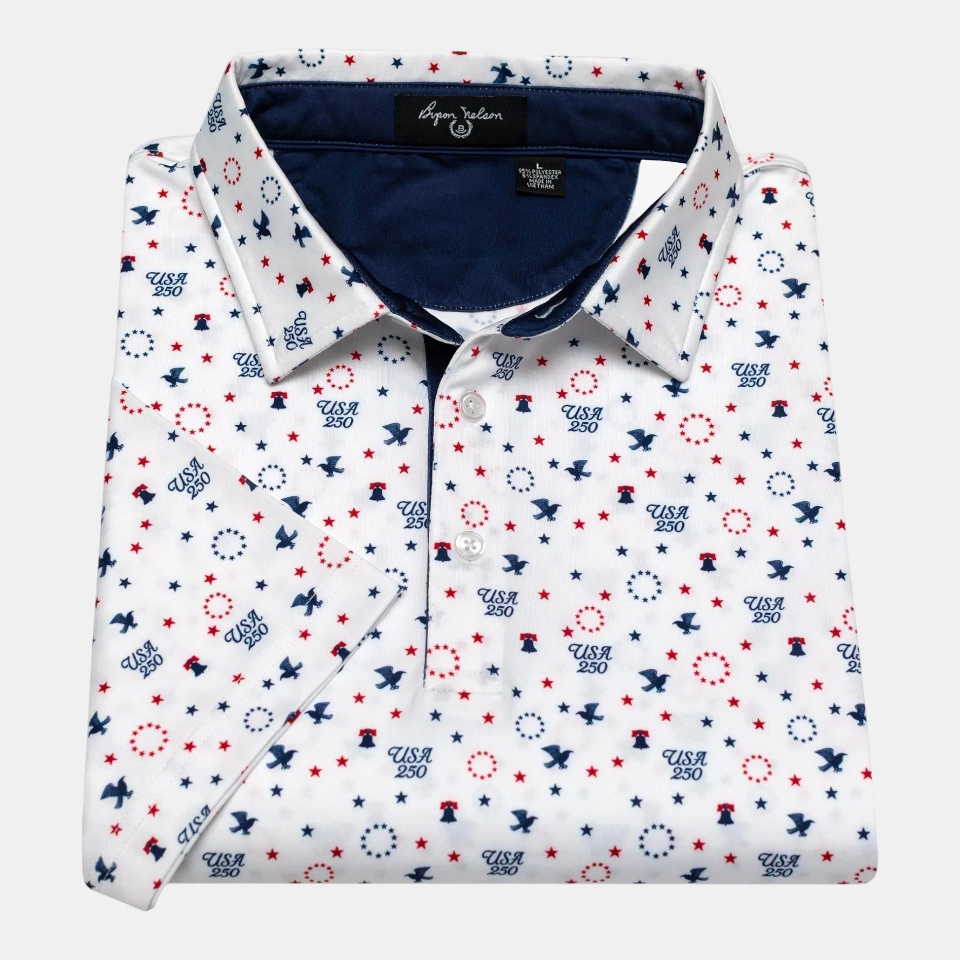 Byron Nelson white short-sleeve polo shirt with USA 250th Anniversary patriotic print, featuring stars, eagles, and Liberty Bells.