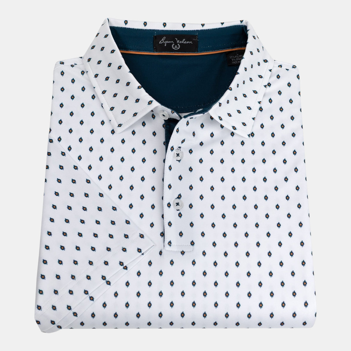 Byron Nelson white polo shirt with a blue and orange geometric diamond print, featuring a tailored collar.