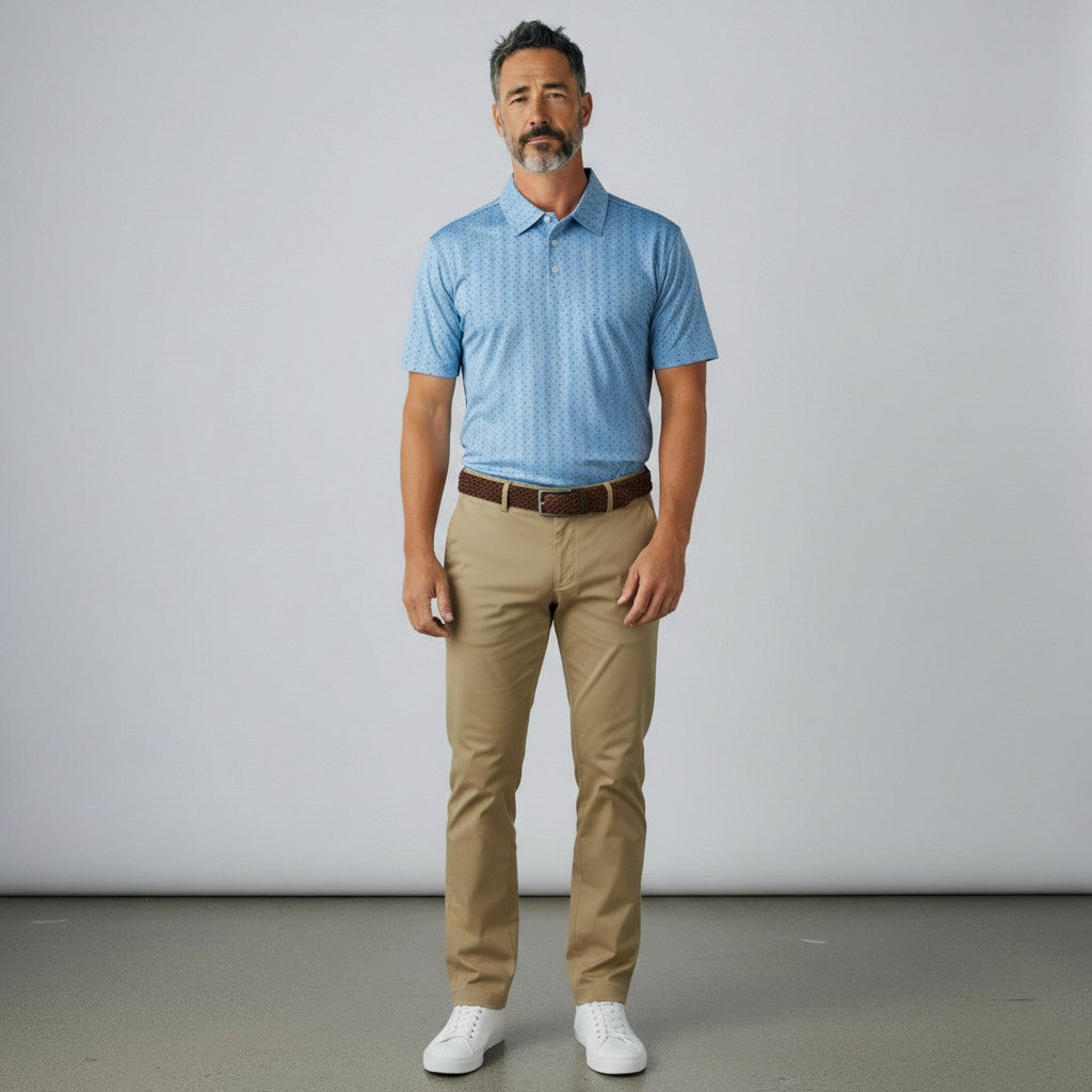Byron Nelson Windward polo shirt in light blue with a subtle pattern, paired with khaki trousers and white sneakers.